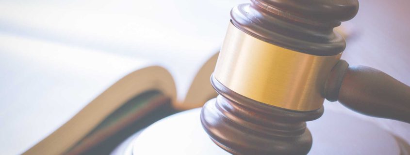 A judge's gavel on a desk, symbolizing legal authority.